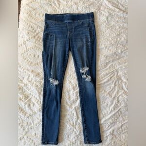 Old Navy mid rise rockstar jegging in distressed black teased dark wash. Size 8.